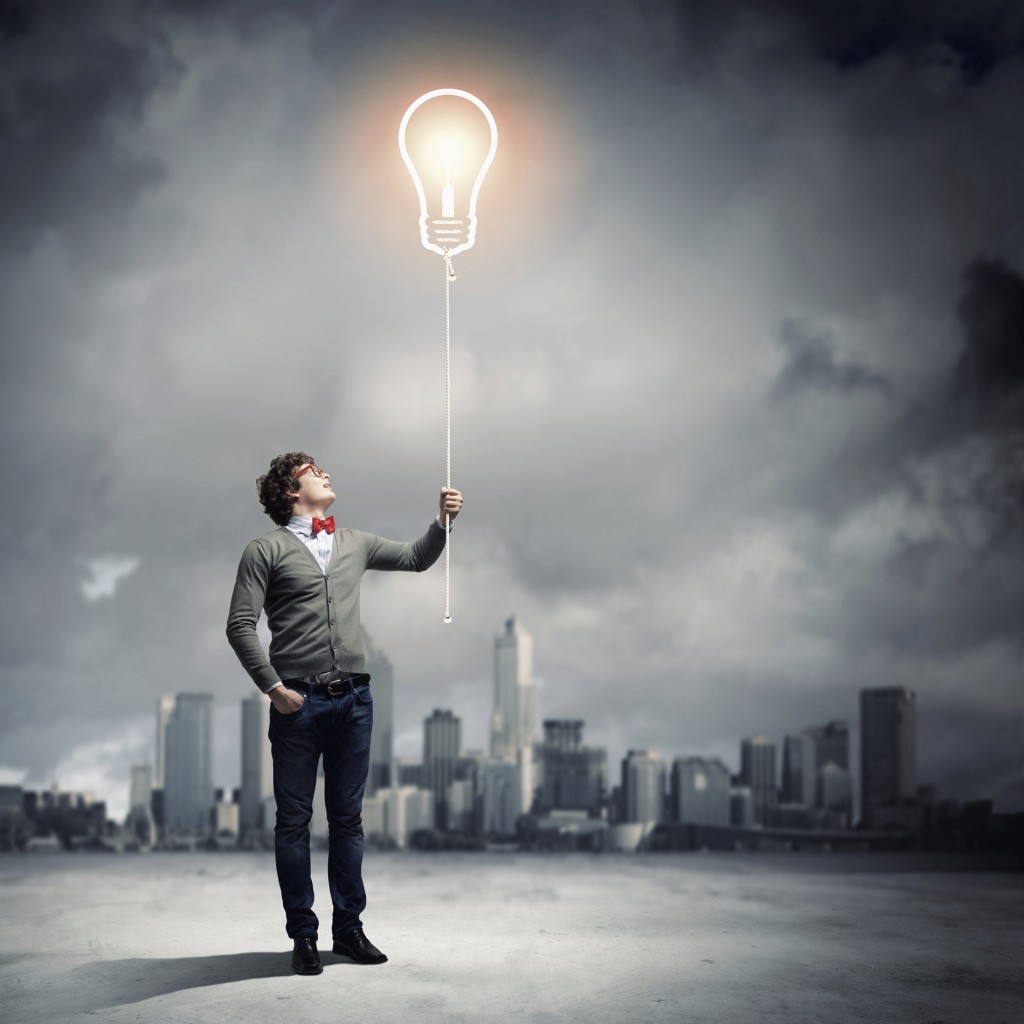 Young man holding a light